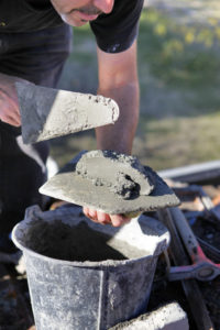 Man with cement and trowel